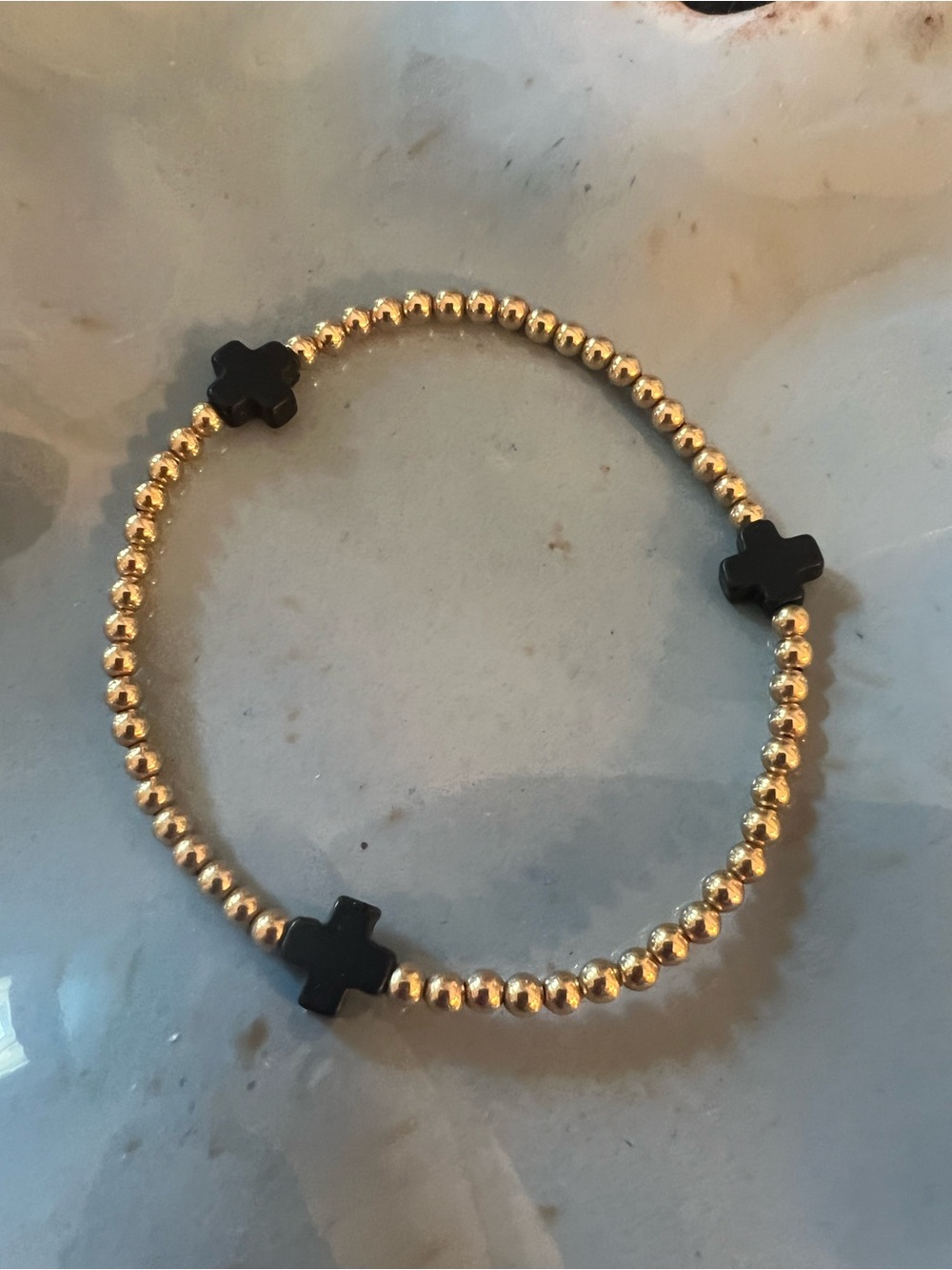 Gold 14k gold filled Beaded Stretch Bracelet with Black Cross Accents
enewton b
